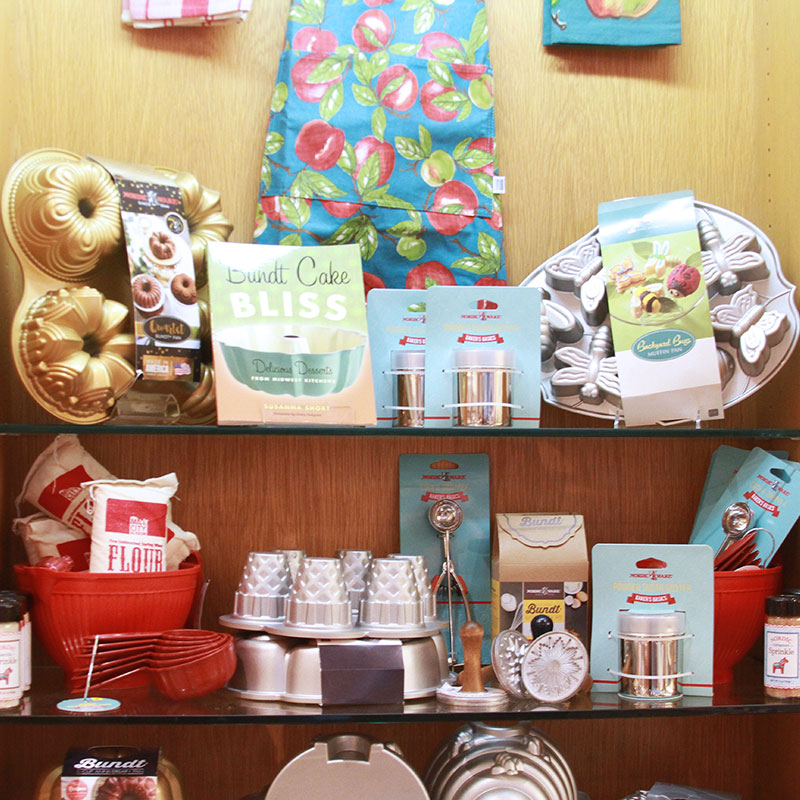 Bundt pans, cookbooks, and kitchen utensils on display in the Minnesota History Center gift shop.