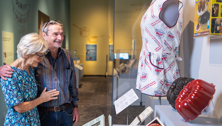 Visitors looking at the objects at the Julia Child Exhibit.